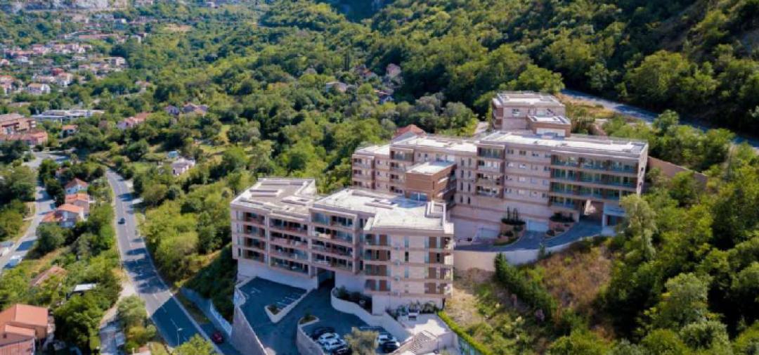 <p>Welcome to the project, a prestigious residential complex ideally positioned at the shimmering edge of Boka Bay, just 2 km from the historic Old Town of Kotor. Blending Mediterranean charm with modern elegance, The project offers a refined lifestyle framed by the stunning Adriatic coast.</p><p>This unique development consists of <strong>5 architecturally harmonious buildings</strong>, each constructed with <strong>earthquake-resistant reinforced concrete</strong> and clad in over 7,500 m² of <strong>natural Travertino Verona stone</strong>. Underneath lies a sophisticated four-layer system of <strong>thermal, hydro, and sound insulation</strong>, designed with thermal bridge technology for year-round comfort and energy efficiency.</p><p>The project features <strong>37 beautifully finished apartments</strong> ranging from 35 m² studios to expansive 232 m² penthouses. With <strong>22 different floor plans</strong>, every lifestyle is accommodated—from cozy singles to large family homes. Each residence is outfitted with <strong>high-quality materials</strong>, including:</p><p>Premium wood parquet floors</p><p>Porcelanosa granite ceramic tiles</p><p>Villeroy & Boch and Noken sanitaryware</p><p>Double-glazed wooden windows with built-in aeration systems</p><p>High-speed optic internet and satellite TV</p><p>Average <strong>bedroom sizes are a generous 22 m²</strong>, and all apartments offer thoughtfully designed layouts to maximize natural light and sea views. Select penthouses span <strong>two levels</strong> and come with private terraces overlooking the bay.</p><p>&nbsp;</p><p>Just minutes away, explore the cobblestone streets of <strong>Kotor’s Old Town</strong>, a UNESCO World Heritage Site rich in Roman-era history and home to <strong>28 acclaimed seafood restaurants</strong>, vibrant markets, and a yacht marina. Nature lovers will enjoy the adjacent <strong>5 km forest walking trail</strong> and panoramic mountain views.</p><p><strong>Tivat International Airport</strong> is only 8 km away, while the <strong>EU border is a mere 60 km</strong> from your doorstep—placing you in the perfect location for both vacation living and long-term residency.</p>