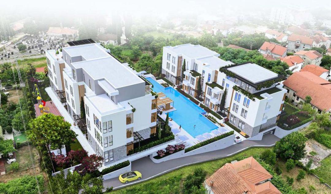 <p>Located along the Adriatic coastline, near the borders of Croatia and Bosnia and Herzegovina, Kumbor dazzles with its peaceful atmosphere, stunning natural beauty, crystal-clear waters, untouched beaches, and panoramic views of the Bay of Kotor.</p><p>The complex, a haven in Montenegro's paradise, nestled in the embrace of the sun and sea, far from the city's hustle and bustle, you will always Kumbor feel the magic of the Mediterranean.</p><p>With its central location close to the sea, city center, historical and tourist spots, and panoramic views of the Bay of Kotor, The project transforms the beauty of living in Montenegro into a privilege.</p><p>The project’s five different types of studios, 1+1, 2+1, and 3+1 residences offer original architecture that meets expectations of luxury, comfort, and prestige, meticulously designed interiors, lush gardens, spacious sea-view balconies and terraces, adding value to your life while providing the comfort of privileged living in Europe.</p><p>At The project, you can swim in the clear waters of the Adriatic Sea or enjoy the sun and tranquility in your residence’s swimming pool. Re-energize in the sports areas, gather with loved ones in social areas for BBQ parties, and let your children safely enjoy cheerful moments in the playground.</p><p>In your meticulously designed residence that brings your dream life into reality, you will feel like you are on an unforgettable vacation with your loved ones.</p><p>The project is located at the entrance of the Bay of Kotor, 6 km from Herceg Novi, a city that draws tourists from around the world with its medieval buildings, timeless streets, and local charm.</p><p>In Herceg Novi, you can savor Montenegrin cuisine and fresh seafood at local restaurants, enjoy pleasant conversations in its cafes, and experience lively nights.</p><p><i>Sea view from all apartments</i></p><p><i>Open-plan living areas</i></p><p><i>Spaces flooded with natural light</i></p><p><i>Ground floor apartments with garden</i></p><p><i>Large selection of apartments</i></p><p><i>Swimming pool with sunbathing area</i></p><p><i>Children playground</i></p><p><i>Place for barbecue</i></p><p><i>Gym</i></p><p><i>All city infrastructure within walking distance</i></p><p>&nbsp;</p>